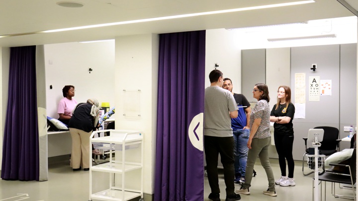 Students in a mock medical treatment room.